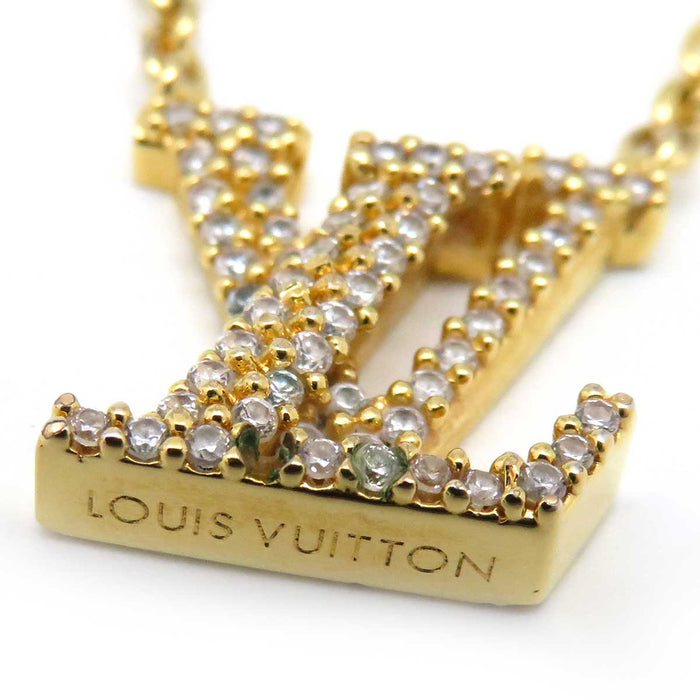 LOUIS VUITTON 
Iniziale Monogramma Fiore Metallo Color Oro 
Collana iconica LV
