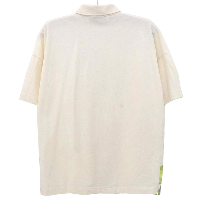 J.W.Anderson. 
JW Anderson Oversize 
J.W.ANDERSON POL ANGLADA Printed Polo Shirt