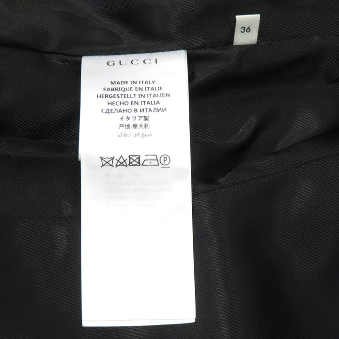 GUCCI 
Interlocking G pearl button 
Web line wool coat