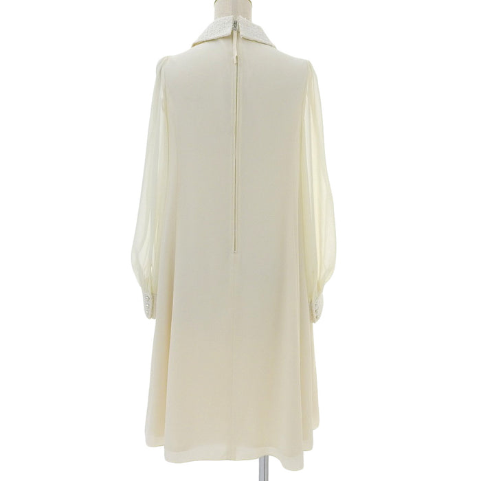 FOXEY 
maniche trasparenti chiffon 
abito color perla tweed