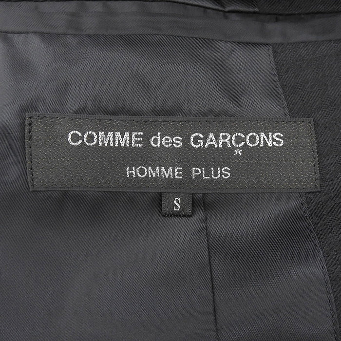 COMME des GARCONS 
Motivo pied de poule lana a contrasto 
Cappotto sartoriale con pelliccia sintetica a incastro 
HOMME PLUS オムプリュス