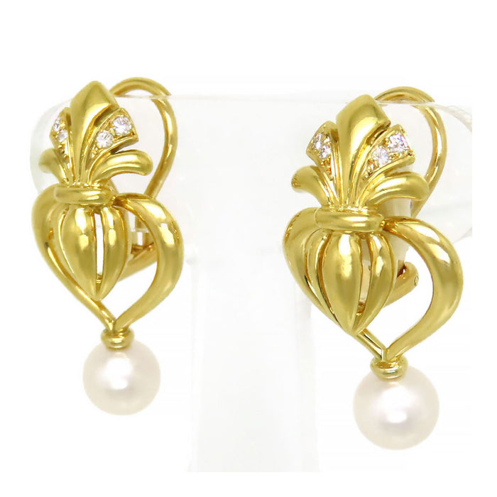 MIKIMOTO 
Orecchini a cuore con charm intercambiabile