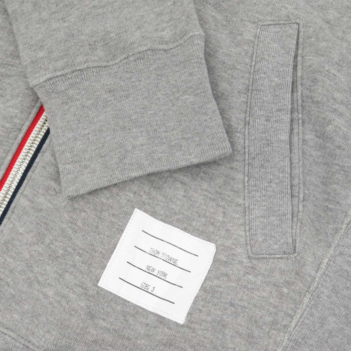 THOM BROWNE
Felpa con cappuccio con zip a righe in cotone
Completo felpa 4 BAR