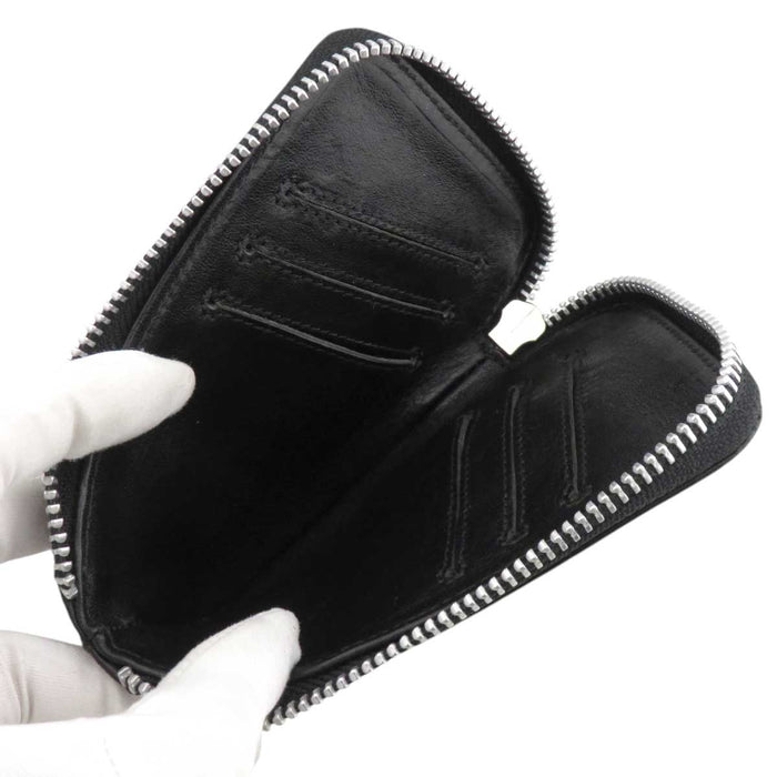 CHROME HEARTS 
ONE TRILLION DOLLARS Flareany Dagger Zip Pelle 
One Trillion Flareany Portafoglio
