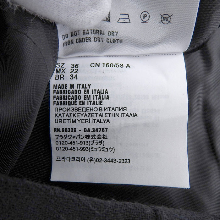MIUMIU
Wool Button
Logo Mini Wrap Skirt