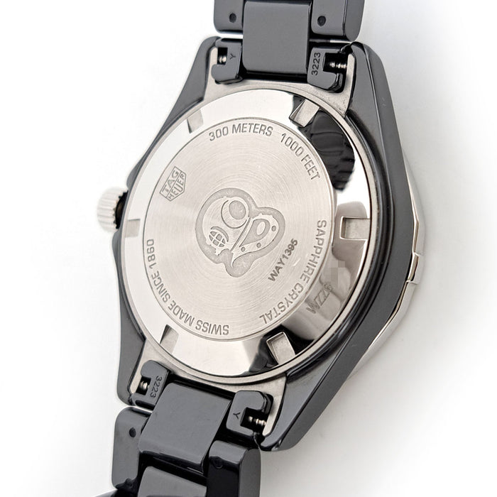TAG HEUER 
Aquaracer lunette en diamant 
Avec boîte et garantie
