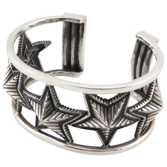 Cody Sanderson 
CODY SANDERSON Sterling Silver Navajo 
CUTOUT OPPOSING STAR Star Bangle