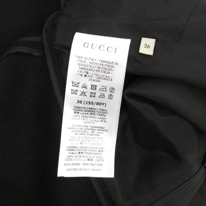 GUCCI 
Logo cintura collo alto a righe 
maniche corte abito in lana