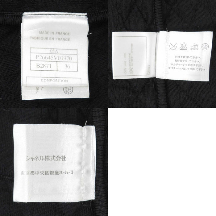 CHANEL 
COCO CC logo matelassé 05A laine chaîne col en V 
veste zippée sans col avec logo Coco