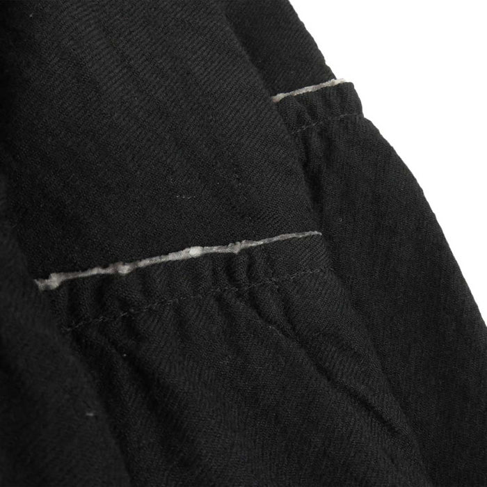 tricot COMME des GARCONS 
tricot COMME des GARCONS 
Gonna a portafoglio in lana con volant di lunghezza midi