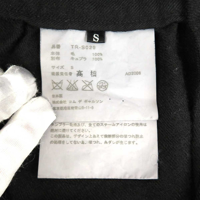 tricot COMME des GARCONS 
tricot COMME des GARCONS 
Gonna a portafoglio in lana con volant di lunghezza midi