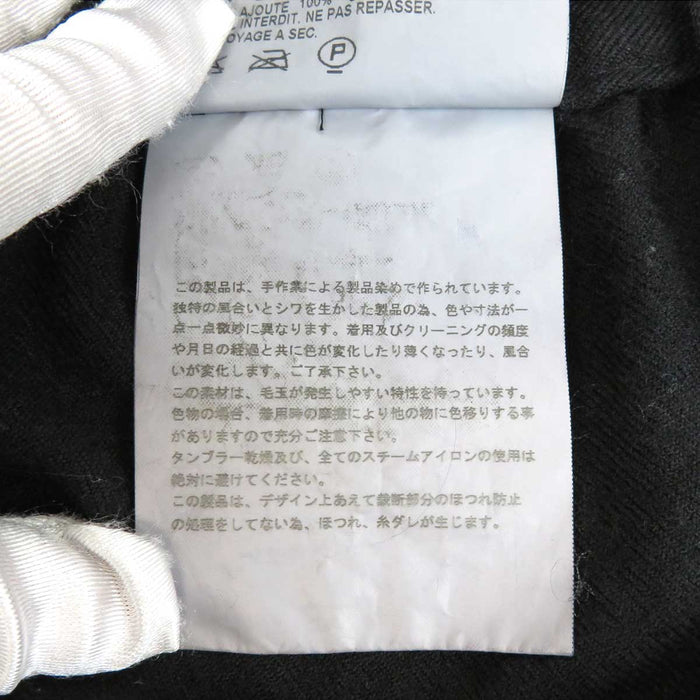 tricot COMME des GARCONS 
tricot COMME des GARCONS 
Gonna a portafoglio in lana con volant di lunghezza midi