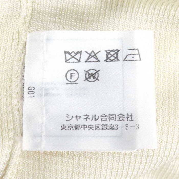 CHANEL 
COCO CC bottone colore oro chiaro metallo colore argento 
marchio Coco giacca di maglia