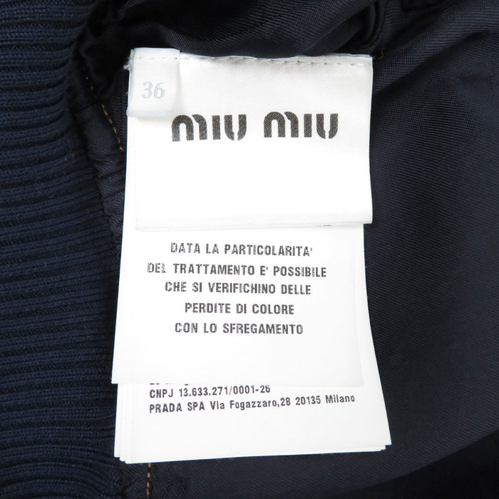 MIUMIU 
Logo ricamato giacca in denim lavato cropped con zip 
Giacca in denim blouson