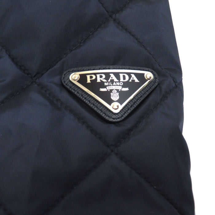 PRADA
High-neck zip-up nylon
Triangle logo padded jacket