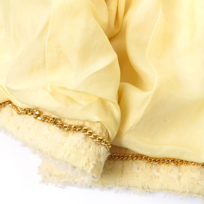 CHANEL 
COCO CC Bottone Coco Giacca senza colletto con fiocco in misto alpaca 93P 
Set vintage in lana con logo Coco