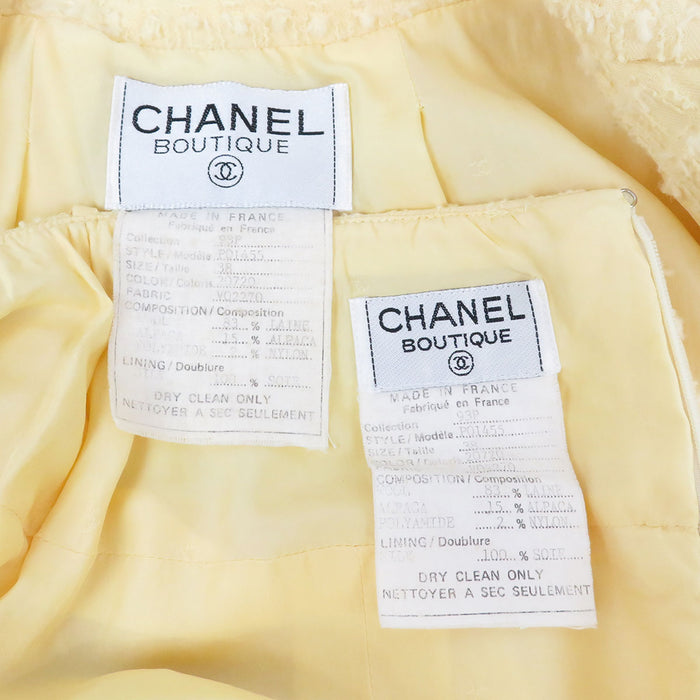 CHANEL 
COCO CC Bottone Coco Giacca senza colletto con fiocco in misto alpaca 93P 
Set vintage in lana con logo Coco