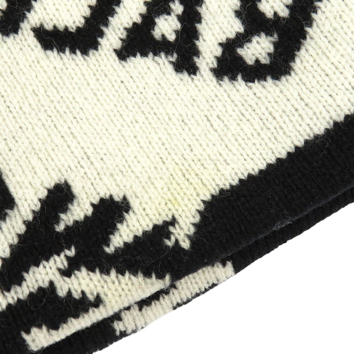 BALENCIAGA 
Laine à motif intégral 
Bonnet en tricot avec logo intégral