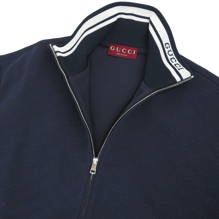 GUCCI
Giacca con zip in nylon tecnico GG a collo alto con logo a motivo integrale