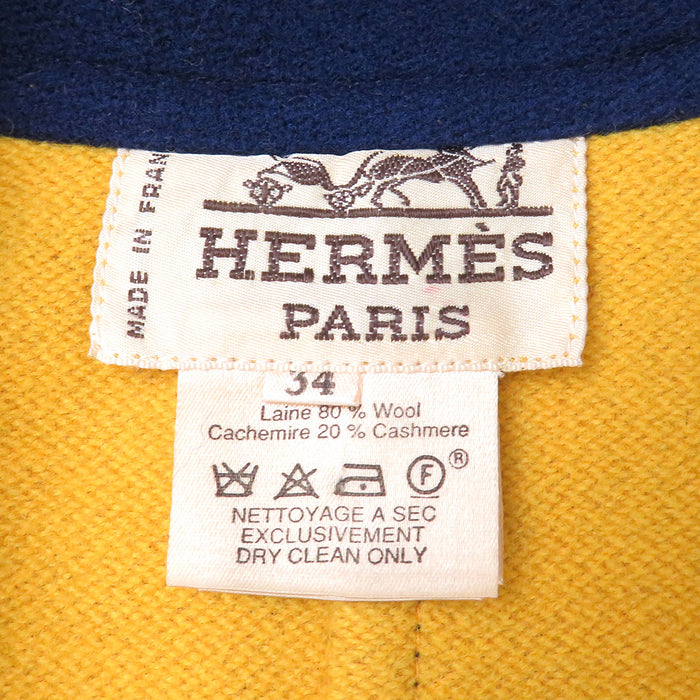 HERMES 
Cintura in pelle con bottoni Serie, misto cashmere 
Cappotto lungo in lana