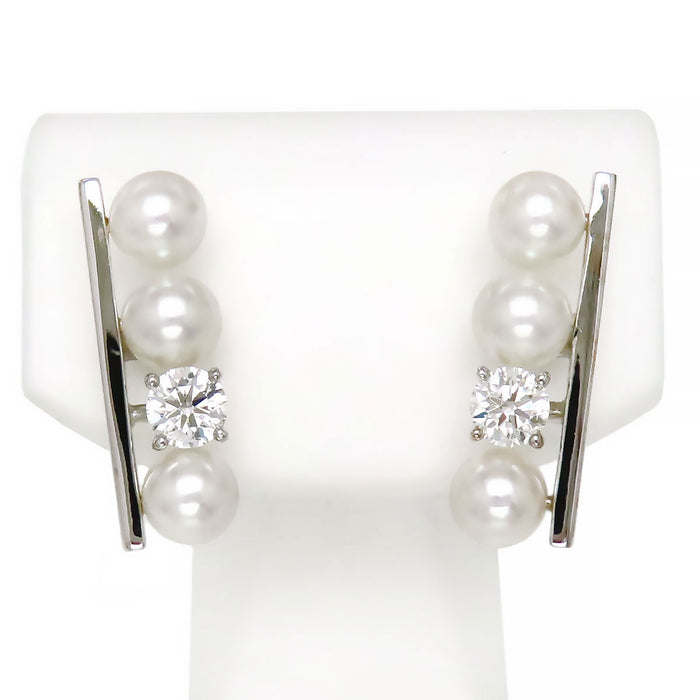 TASAKI 
Boucle d'oreille solitaire diamant équilibre
