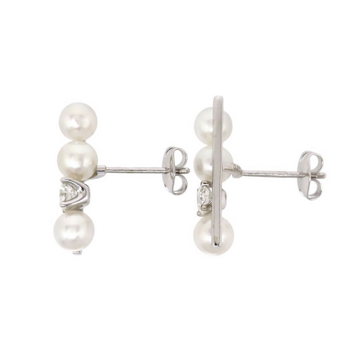 TASAKI 
Boucle d'oreille solitaire diamant équilibre