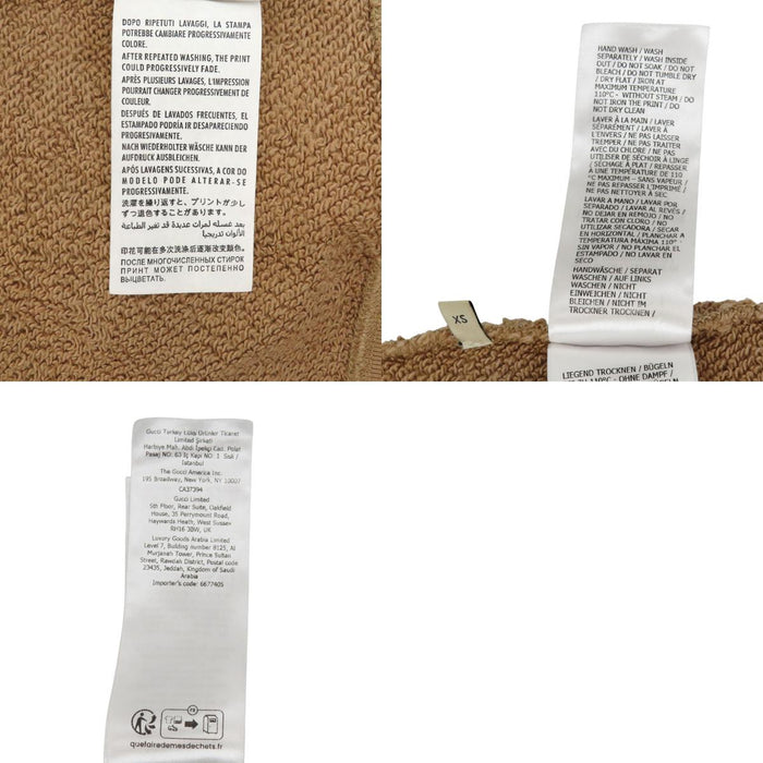 GUCCI 
Sweat à capuche 
Veste à demi-fermeture éclair avec logo imprimé au dos