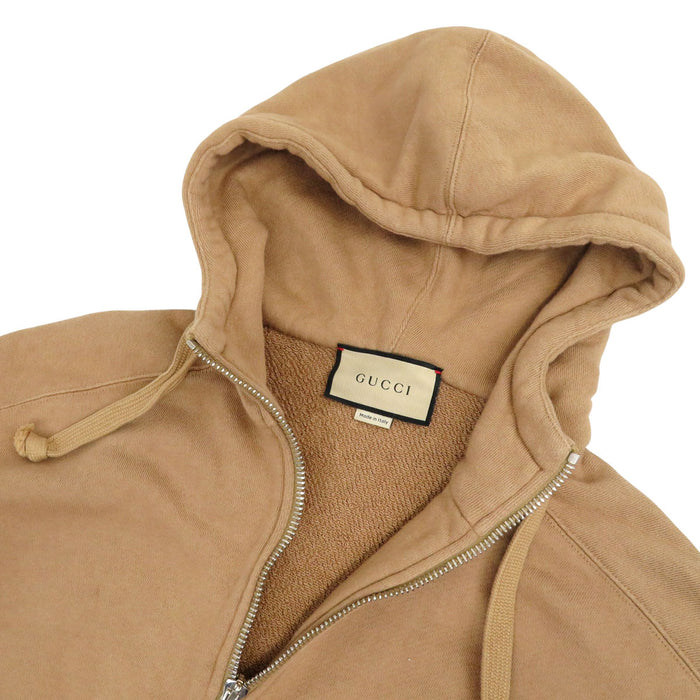 GUCCI 
Sweat à capuche 
Veste à demi-fermeture éclair avec logo imprimé au dos