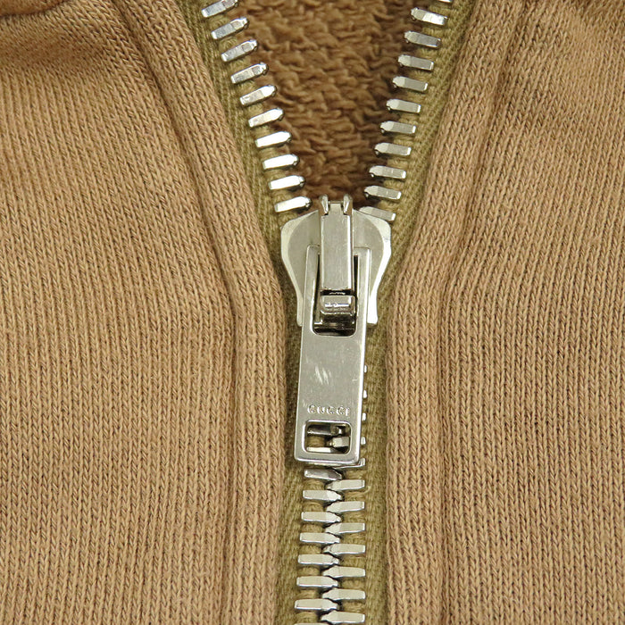 GUCCI 
Sweat à capuche 
Veste à demi-fermeture éclair avec logo imprimé au dos