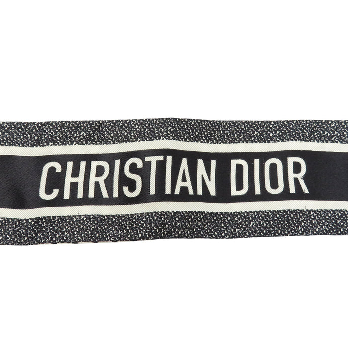 Dior  
Logo Houndstooth Silk  
30 Montaigne Mitzah Scarf