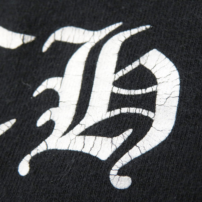 CUORI DI CROMO 
MAGLIA A MANICHE CORTE CON MOTIVO A FIORE E VOLUTE IN COTONE 
MAGLIA A MANICHE CORTE CON STAMPA A FIORE A CAMPANA