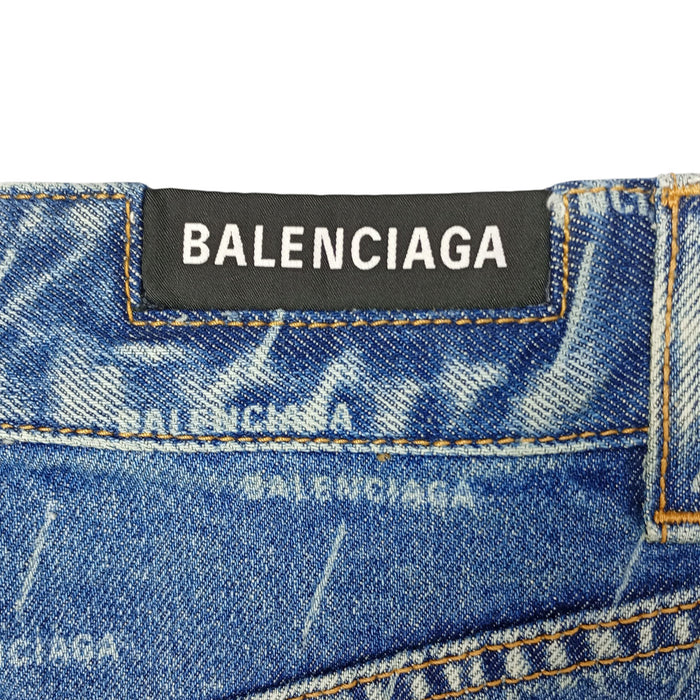 BALENCIAGA  
Jupe en denim à logo  
en coton à motif intégral avec franges