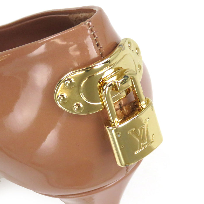 LOUIS VUITTON 
LV logo verni 
Escarpins à talons hauts avec cadenas