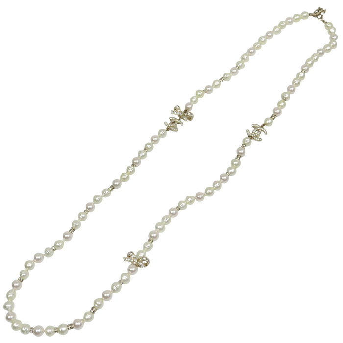 CHANEL  
COCO CC Logo Rhinestone Gold Color Metal B23S  
Coco Mark Costume Pearl Long Necklace