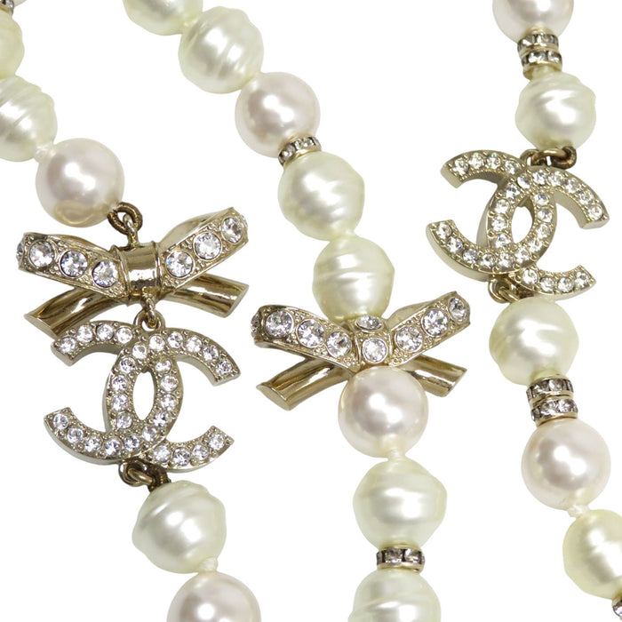CHANEL  
COCO CC Logo Rhinestone Gold Color Metal B23S  
Coco Mark Costume Pearl Long Necklace