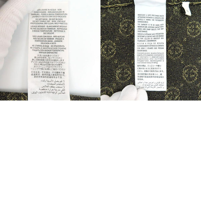 GUCCI  
Logo motif intégral  
Pull à manches courtes GG pailleté