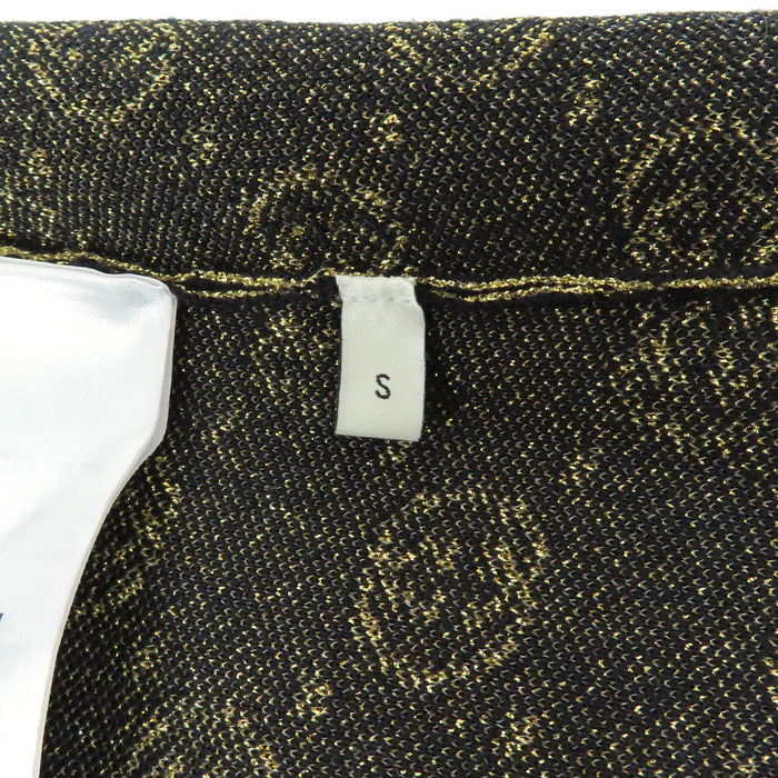 GUCCI  
Logo motif intégral  
Pull à manches courtes GG pailleté