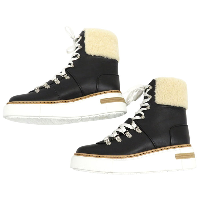 HERMES  
Bottines à lacets en cuir  
Flocon mouton cheville