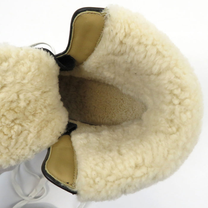 HERMES  
Bottines à lacets en cuir  
Flocon mouton cheville