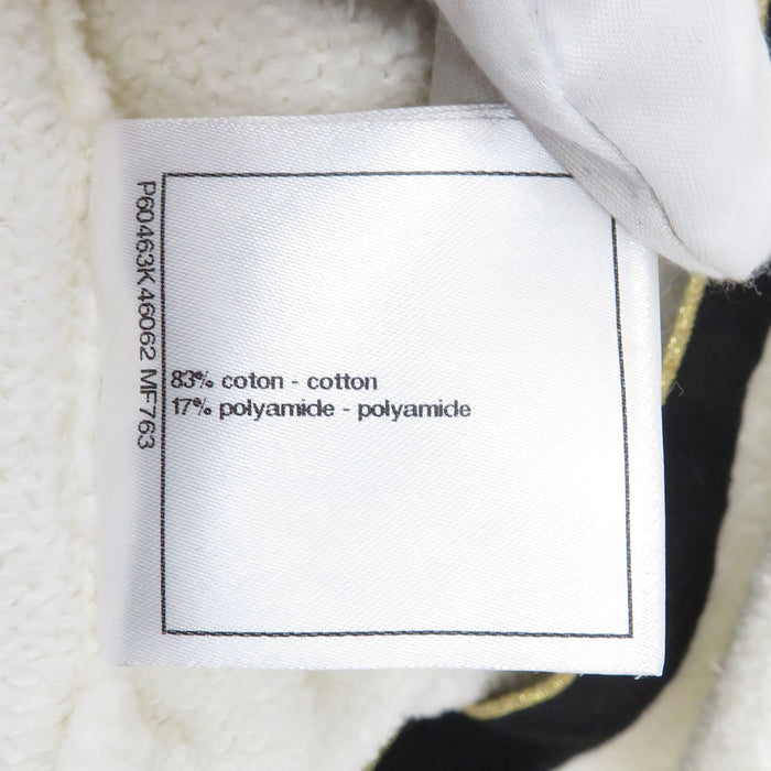 CHANEL  
COCO CC Bouton bicolore métal couleur or  
Robe en coton avec logo Coco