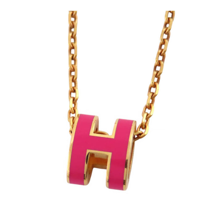 HERMES  
Collier mini Pop Ash H en métal doré avec logo H Ash