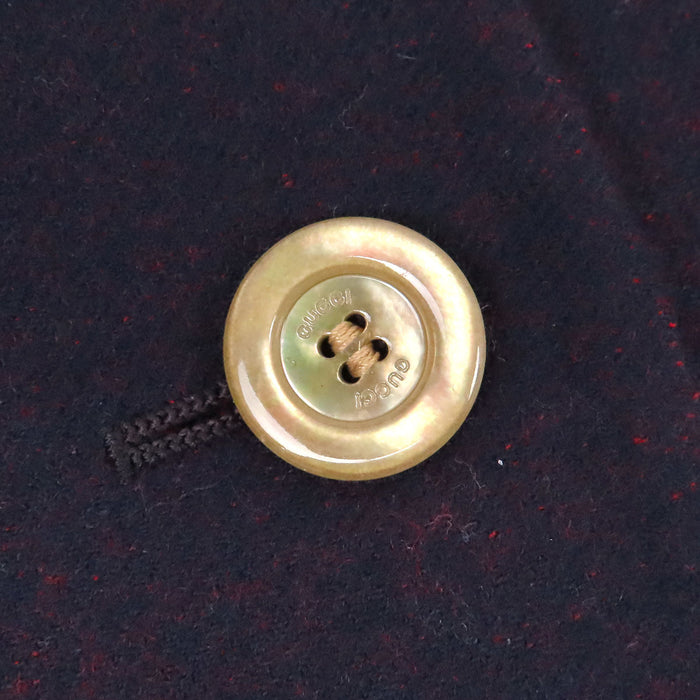 GUCCI 
Jupe en laine rayée fendue avec boutons logo GG 
G interlocking G