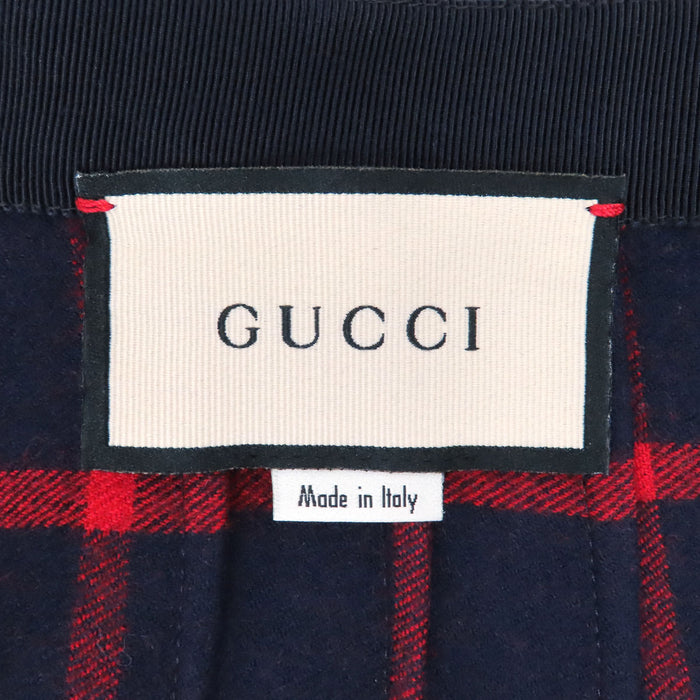 GUCCI 
Jupe en laine rayée fendue avec boutons logo GG 
G interlocking G