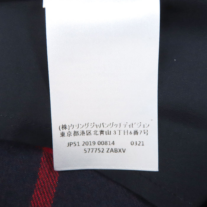 GUCCI 
Jupe en laine rayée fendue avec boutons logo GG 
G interlocking G