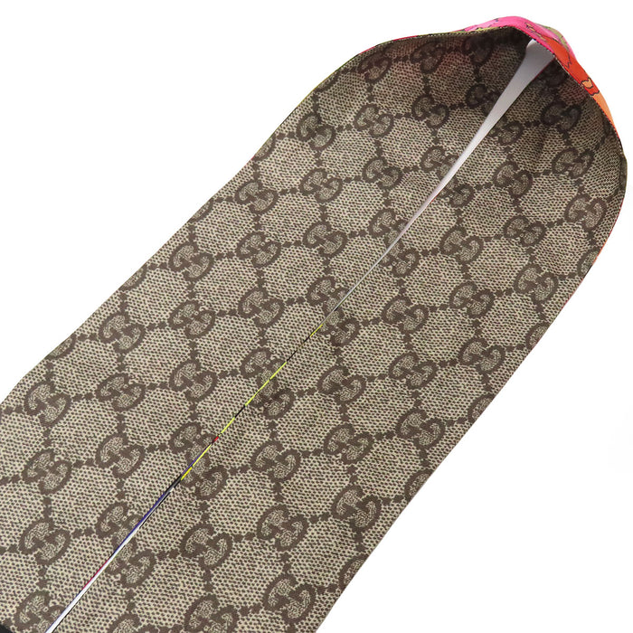 GUCCI 
Foulard logo soie 
Twilly nœud cou GG Flora