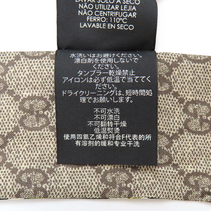 GUCCI 
Foulard logo soie 
Twilly nœud cou GG Flora