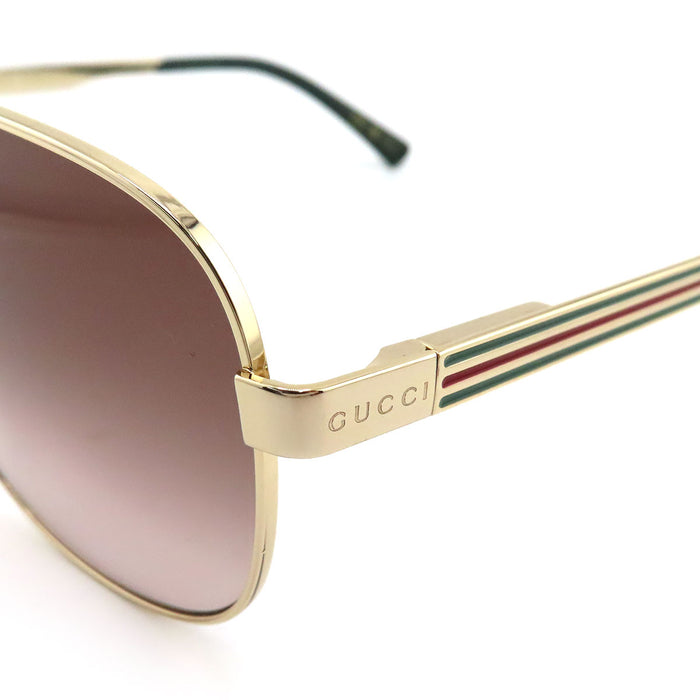 GUCCI  
Lunettes de soleil aviateur à double pont avec bande Web rayée