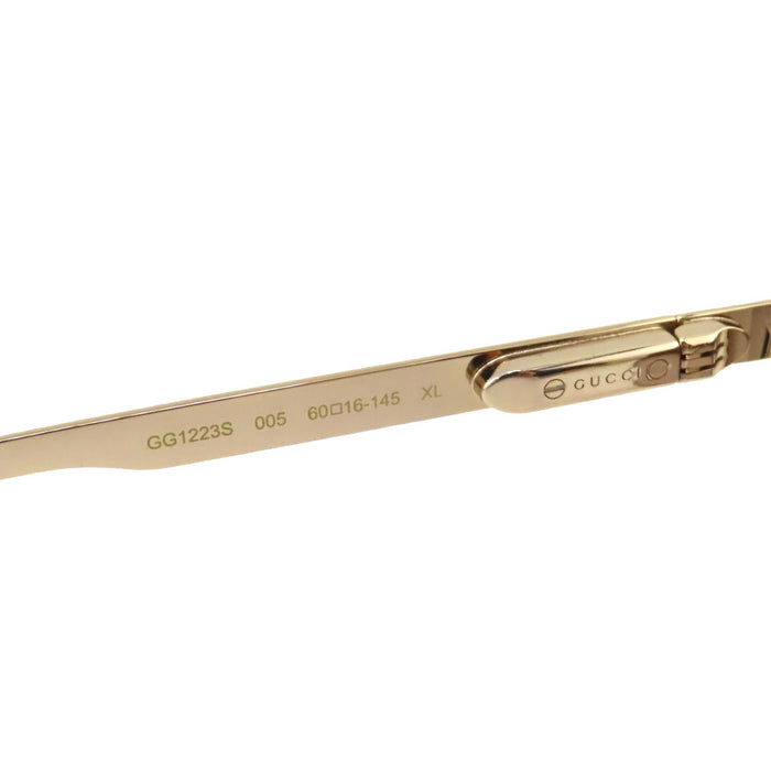 GUCCI  
Lunettes de soleil aviateur à double pont avec bande Web rayée