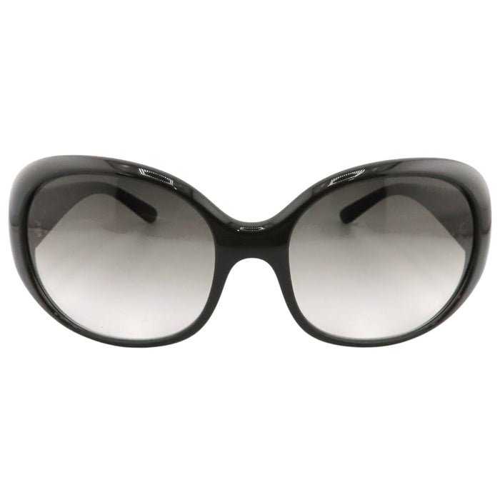 PRADA  
Lunettes  
Lunettes de soleil à branches avec logo triangulaire