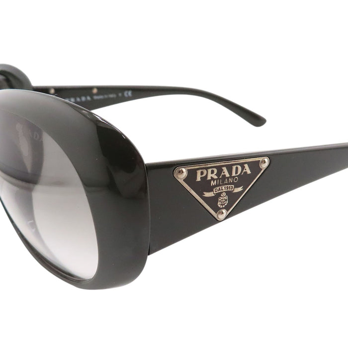 PRADA  
Lunettes  
Lunettes de soleil à branches avec logo triangulaire